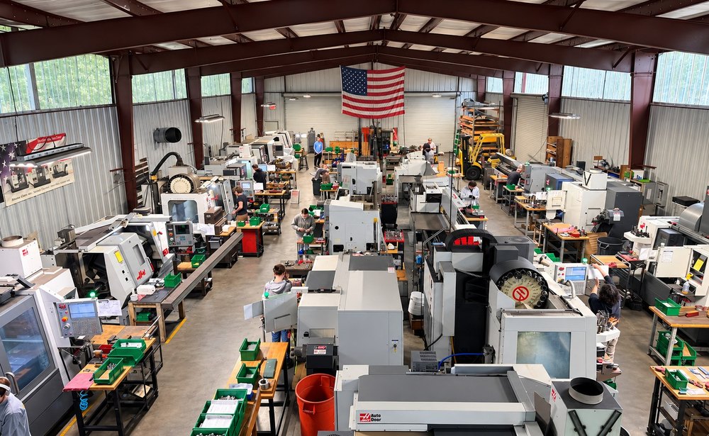 Machinists at work on the shop floor at Losch Machine Inc.