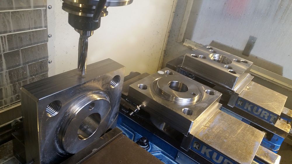 Vertical mill machining flanged parts held in vises